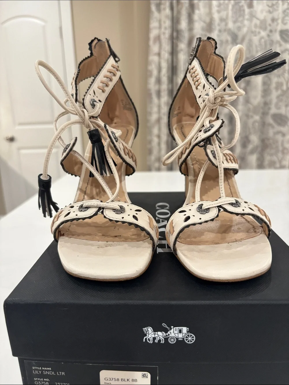 Coach Ivory and Black Studded Tassel High Heel Sandals